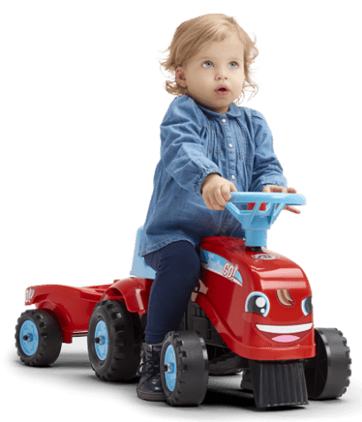 bébé sur un porteur rouge Falk Toys