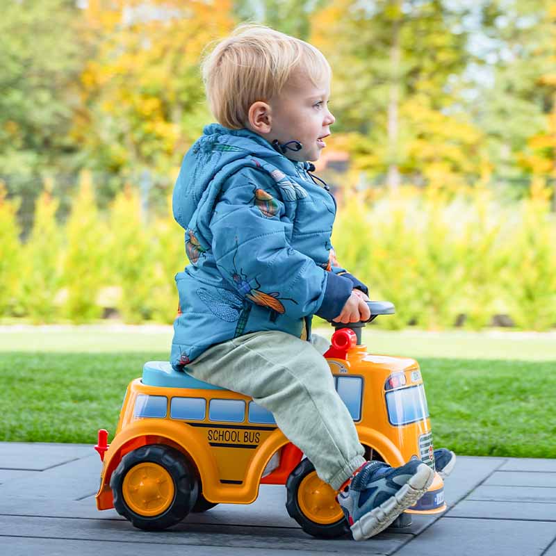 Boy on Ride-on School Bus