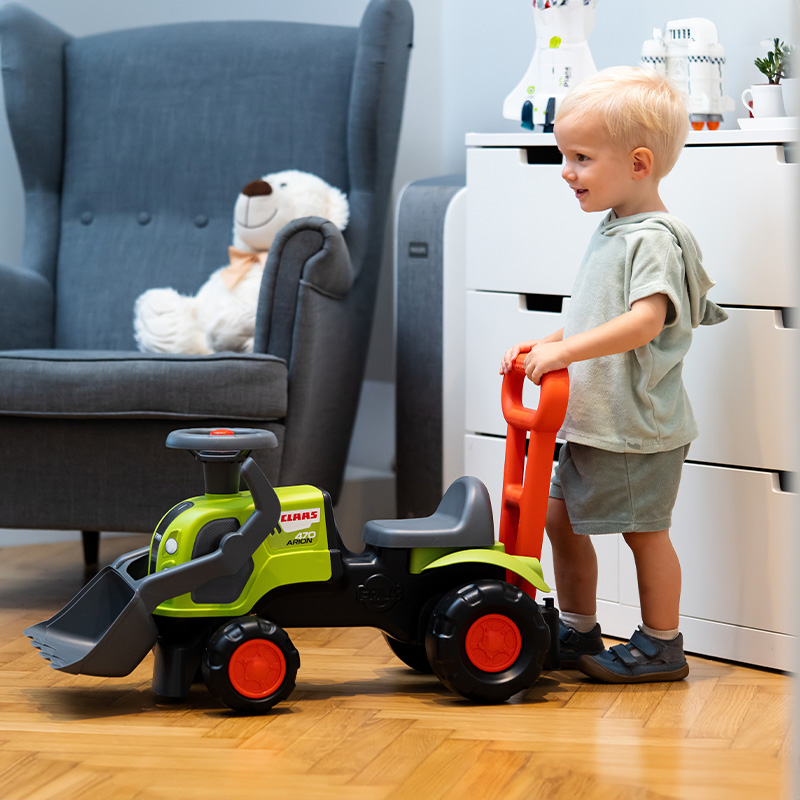 Boy with Ride-on Tractor Claas