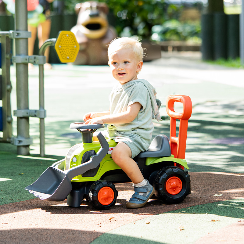 Boy on Ride-on Tractor Claas