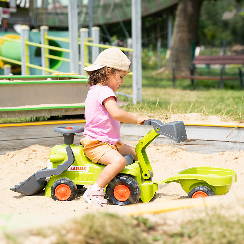 Girl on Ride-on Tractor CLAAS