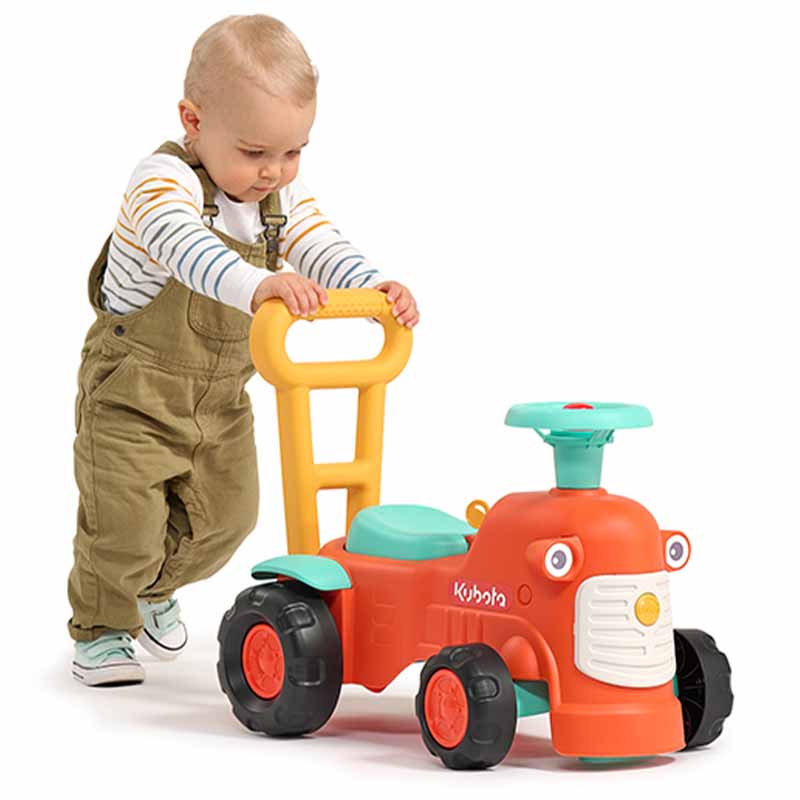 Boy with Ride-on Tractor Kubota
